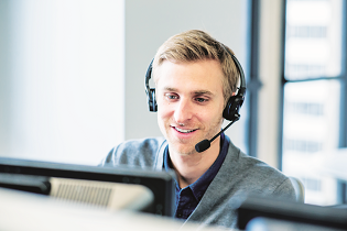 A person sitting in front of a computerDescription automatically generated